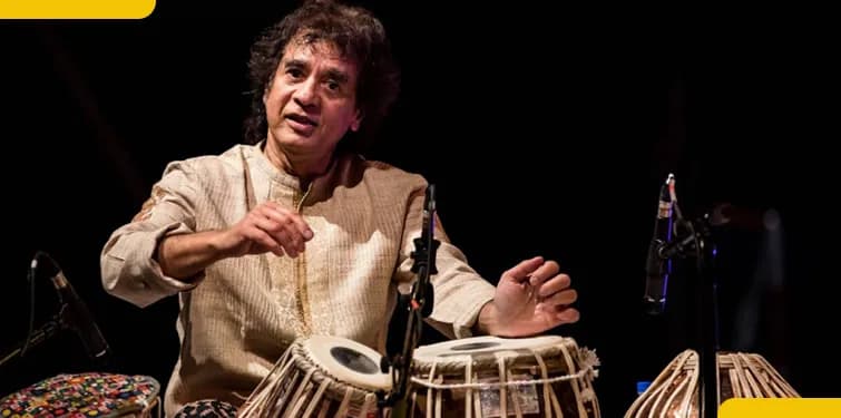 Musician playing tabla drums on a stage