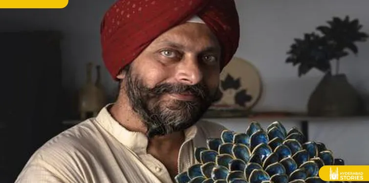 Man in a red turban seated indoors
