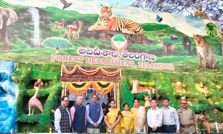 Group posed before a painted wildlife backdrop
