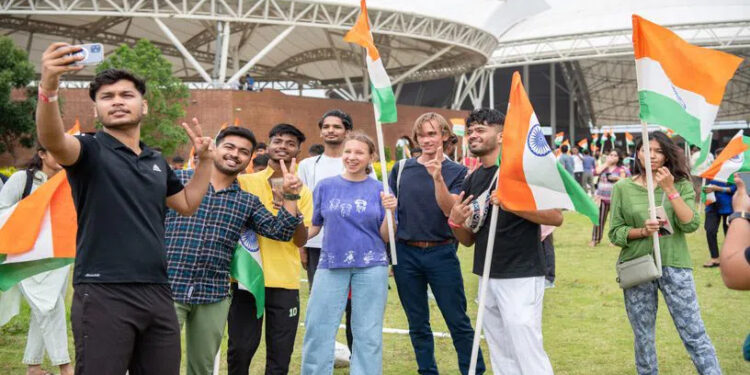 Hyderabad: Youth from across the world wave the Indian National Flag at the world’s largest meditation center