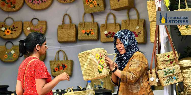 A gathering of skilled Indian artisans presenting their artwork.